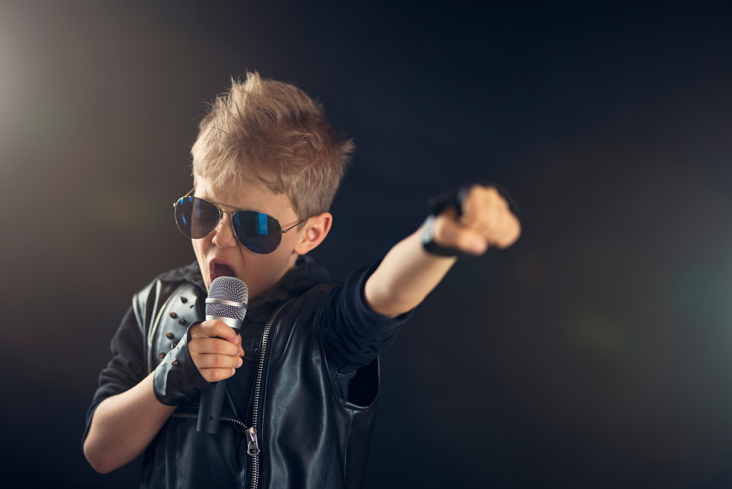 Little boy singing rock